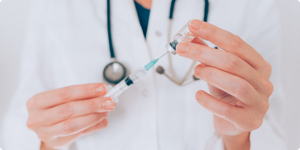doctor prepping an injection